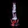 A fantasy dildo standing in front of a black background.