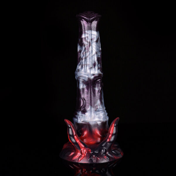 A fantasy dildo standing in front of a black background.