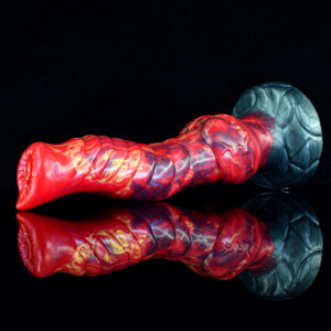 A red and black sex toy displayed with a clear reflection, showcasing its vibrant colors and smooth surface.