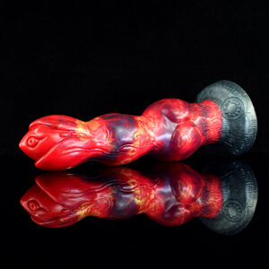 A red and black fantasy dildo with a shiny reflection, highlighting its unique design and texture.