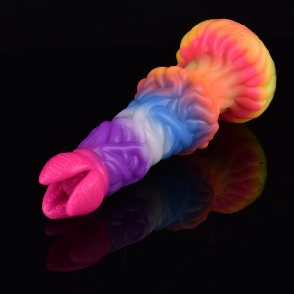 A colorful and playful looking fantasy dildo laying on a black reflecting surface. The dildo has lots of texture and a big knot on its shaft.