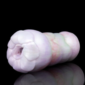 A pink masturbator sex toy for men in front of a black background.