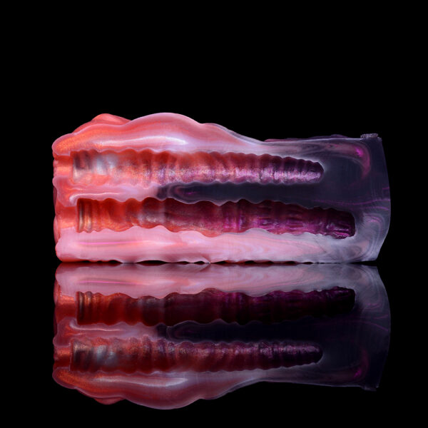 A side view of a male sex toy with two channels.