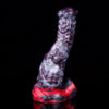 A vibrant monster dildo with a durable black and red base.