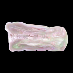 A silicone masturbator cut in half to showcase the inside channel of the toy.