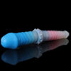 A blue and pink double dildo, laying on a black and reflective surface.