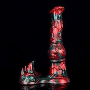 A knotted fantasy horse dildo standing on its suction cup in front of a black background.