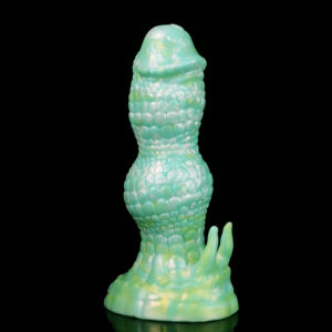 A green dildo in front of a black background.