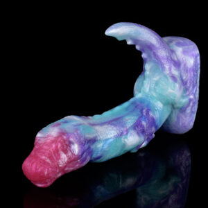 A purple and blue fantasy dildo in the form of a t-rex. The dildo features a pink head for g-spot stimulation and a tail for anal penetration.